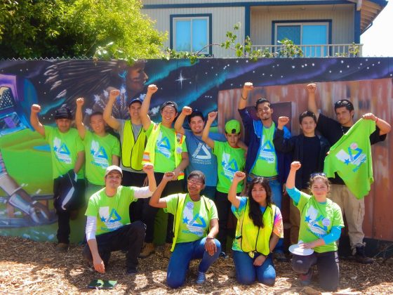 Javier and Groundwork Richmond Green Team in front of Richmond Greenway mural