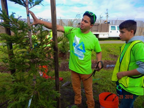 Javier supervises youth tree planting in Richmond