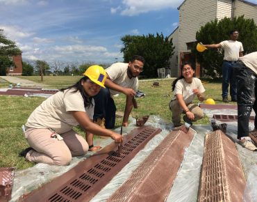 Groundwork Elizabeth Youth leader Adriana Morocho and Green Team members Dionis Ramirez and Jennifer Lam refinish the radiators