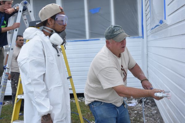 Curt Collier demonstrates spray painting techniques